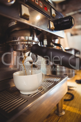 Machine making a cup of coffee