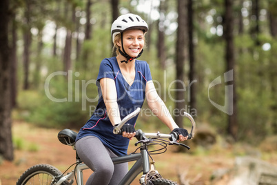 Pretty young biker looking at camera