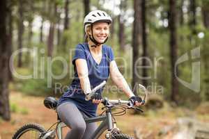 Pretty young biker looking at camera