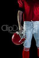 American football player holding his helmet
