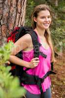 Smiling blonde hiker with backpack