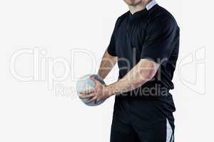 Rugby player about to throw a rugby ball