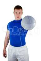 Rugby player handing a rugby ball