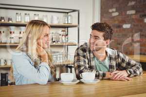 Smiling hipster sitting and talking