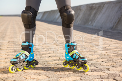 Close up view of woman wearing inline skates