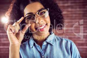 Smiling attractive hipster posing with glasses