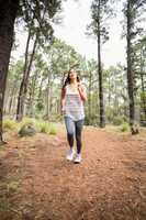 Young happy jogger walking