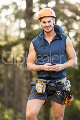 Handsome young hiker looking at camera