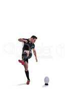 Rugby player kicking the ball