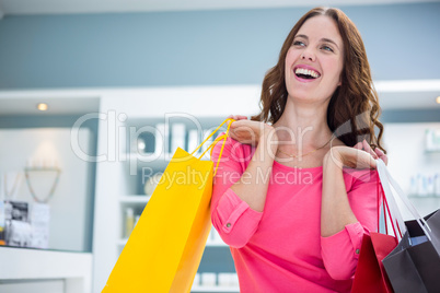 Pretty woman holding shopping bags