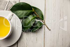 Cup of herbal tea on table