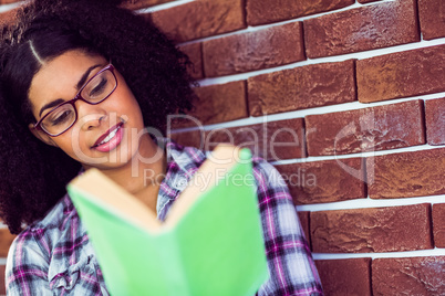 Attractive hipster reading book