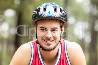 Handsome young biker looking at camera