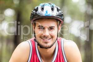 Handsome young biker looking at camera