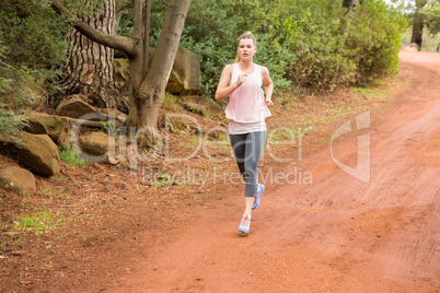 Pretty blonde athlete jogging