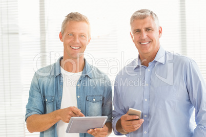 Business colleagues working on tablet and phone