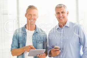 Business colleagues working on tablet and phone