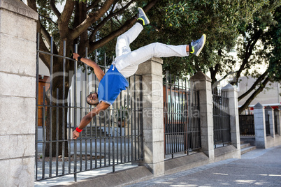 Extreme athlete jumping in front of building