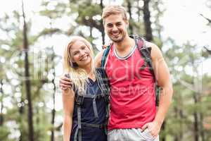 Happy young couple looking at camera