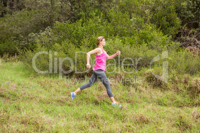 Pretty blonde athlete jogging