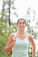 Happy jogger running and listening to music