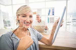 Smiling businesswoman holding a tablet