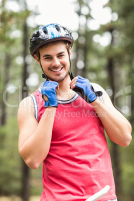 Handsome young biker looking at camera