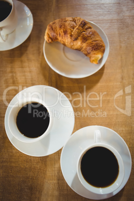 Cups coffee with croissant