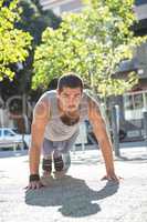 A muscular man on plank position