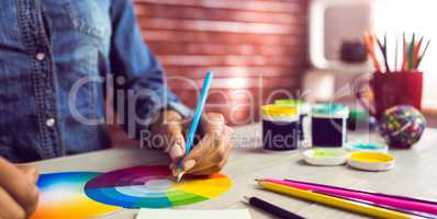 Graphic designer drawing on colour chart