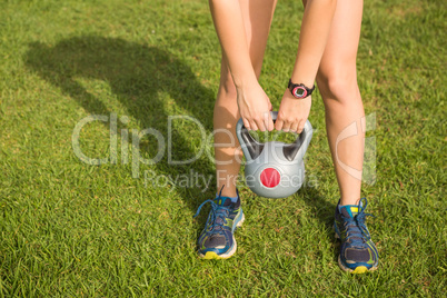 Sporty woman exercising with kettlebell