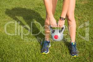 Sporty woman exercising with kettlebell