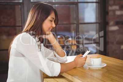 A beautiful businesswoman using a smartphone