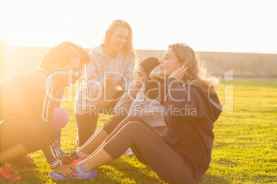 Sporty women doing sit ups during fitness class