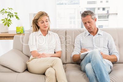 Concerned therapist talking with female patient