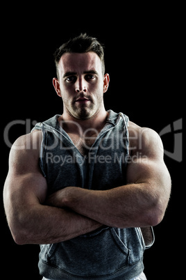 Handsome bodybuilder with arms crossed