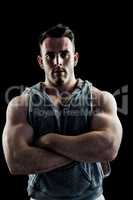 Handsome bodybuilder with arms crossed