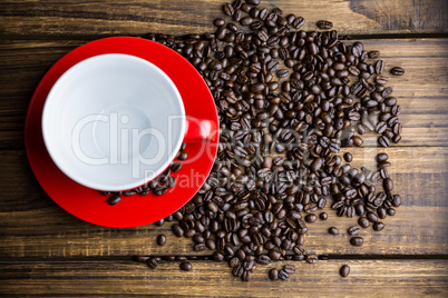 Coffee beans on a table with cup