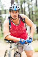 Handsome young biker looking at camera