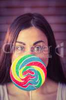 Pretty hipster with lollipop