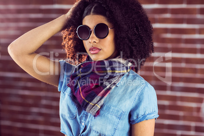 Attractive young woman wearing sunglasses