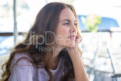 Pretty woman sitting outside having coffee