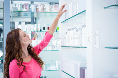 Pretty woman shopping for cosmetics