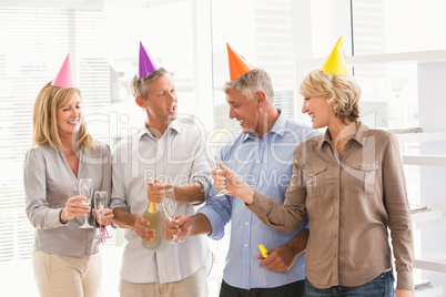 Casual business people toasting and celebrating birthday