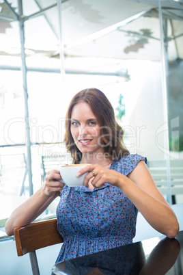 Pretty brunette smiling at camera