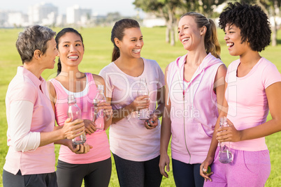 Women wearing pink for breast cancer and talking