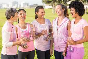 Women wearing pink for breast cancer and talking