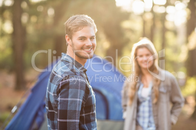 Happy young camper couple smiling