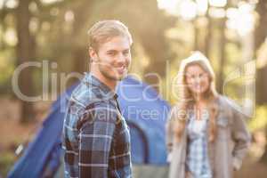 Happy young camper couple smiling