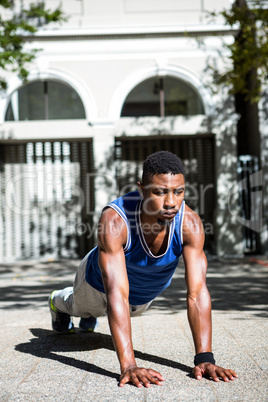 Happy athlete doing push-ups Happy athlete doing push-ups